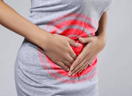 Тянущая боль в животе